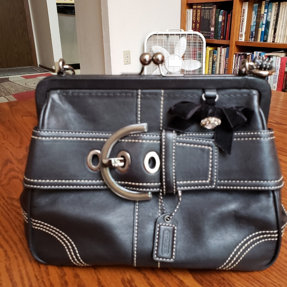 Coach kisslock black leather purse.